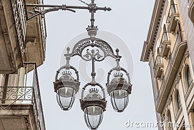 Beautiful hanging street lamp with an original metal design Stock Photo